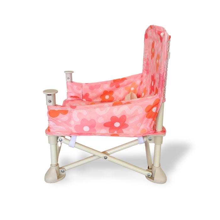 Bloom Portable Baby Highchair with detachable tray. Comes in a carry bag. For kids aged 6M-3Y. Image depicts chair side view